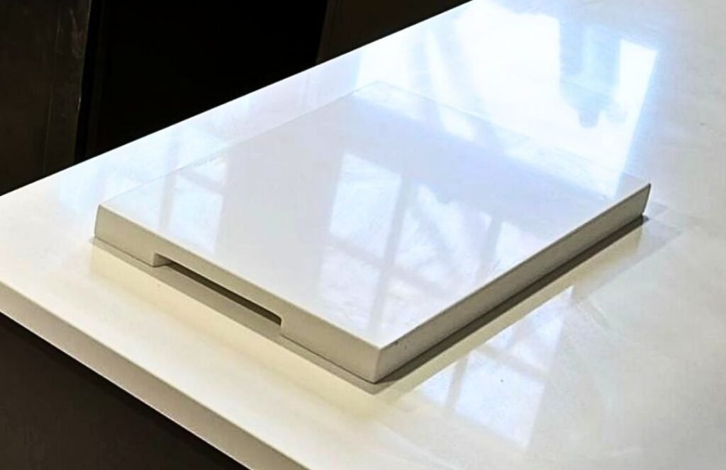 Custom cutting board cut from the same stone slab as the customer's countertop