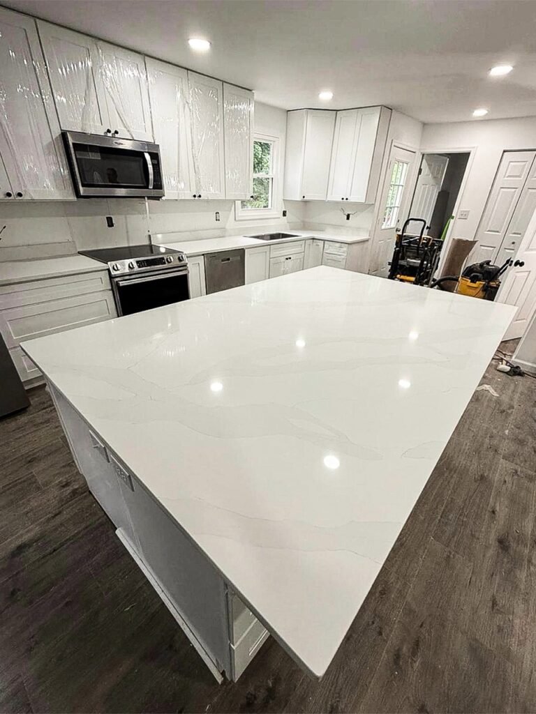 Large white quartz island with waterfall edge