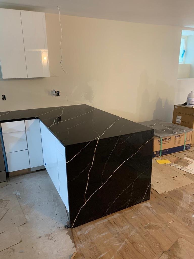 Black quartz waterfall island — Quartz Solution, North Carolina